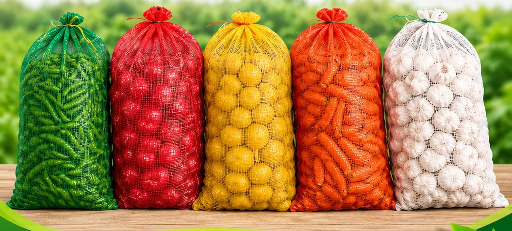 Leno mesh bags filled with beans, tomatoes, lemons, carrots and garlic