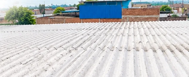 Recycled plastic roofing sheets installed on a building roof