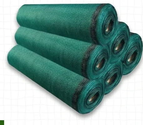 Stacked rolls of green shade net ready for dispatch